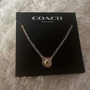 Rose gold Coach heart necklace with dust cover